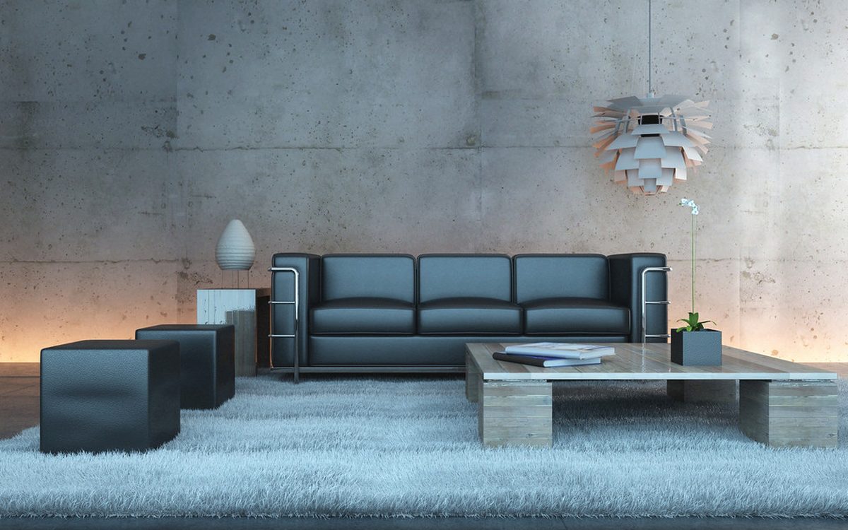 A living room with a sofa and rug